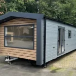 Casa mobile Globus XL 11,5 x 4 m con due camere - immagine 1