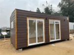 Casa modulare Fernandez 6 x 3 m – 18 m² siding bordeaux con portefinestre PVC bianco - immagine 3