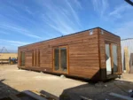 Casa modulare González 10 x 3 m – 30 m² siding legno caldo con cabina doccia idromassaggio - immagine 1