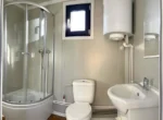 Modulo Abitabile 14 m² — Rivestimento Totale in Listoni Verticali di Pino Naturale con Grande Porta Scorrevole Antracite - immagine 9
