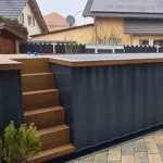 Piscina container Premium 6,11 m grigio antracite con scala WPC e pompa di calore - immagine 1